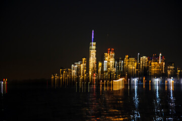 Fototapeta premium Abstract Long exposure lighting of Manhattan, from Hudson bay, NYC, USA
