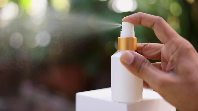 Close-up of a hand-operated spray nozzle. Clean using spray solution. Cleaning, protection concept, antivirus, bactericidal spray
