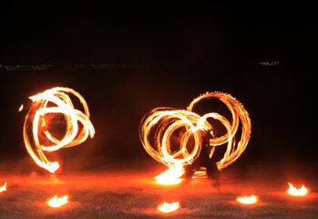 fire dancer Perform a fire show to create beautiful lines in front of the beach. At night