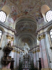 Fototapeta na wymiar Main baroque altar in Church Of Saint Peter and Paul, designed by Jan Blazej Santini-Aichel, benedictine monastery in Rajhrad near Brno city, Czech Republic.