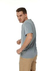 annoyed angry man standing on white studio background