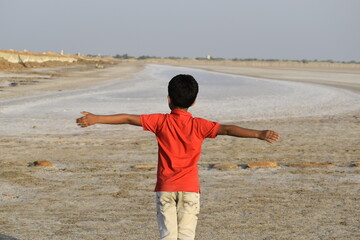 child playing on the beach