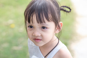 Portrait of a young Asian girl smiling at the camera - Happy Thai girl having fun posing.