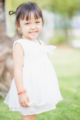 Portrait of a young Asian girl smiling at the camera - Happy Thai girl having fun posing.