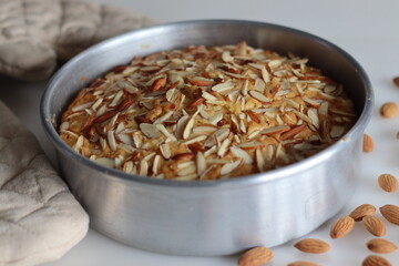 Almond buttermilk cake. A delicious cake adorned with a generous sprinkle of chopped almonds, perfect for tea time