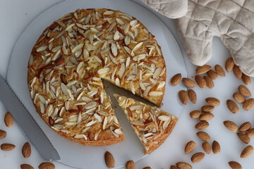 Sliced almond buttermilk cake. A delicious cake adorned with a generous sprinkle of chopped...