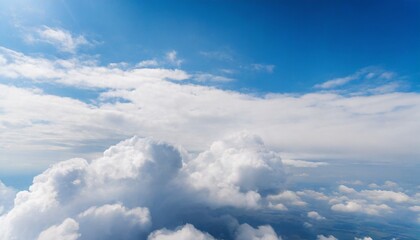 white clouds on blue sky background close up cumulus clouds high in azure skies beautiful aerial cloudscape view from above sunny heaven landscape bright cloudy sky view from airplane copy space