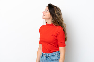 Young caucasian woman isolated on white background laughing in lateral position