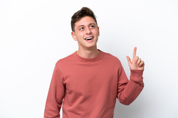 Young handsome Brazilian man isolated on white background pointing up and surprised