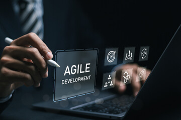 Agile development methodology, businessman use laptop with virtual screen of agile icon for process that will help you work faster By reducing step-by-step work and focusing on team communication.