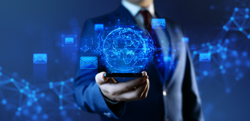 Businessman with Globe Hologram and icons: Message Email Mail Communication Online Chat Concept