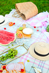 Picnic background with white wine on green grass