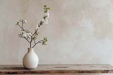 Foto op Plexiglas A simple vase with a branch on a wooden table. Simple yet elegant decoration. © Jouni