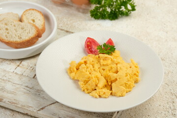 Scrambled eggs, omelette. Breakfast with pan-fried eggs.