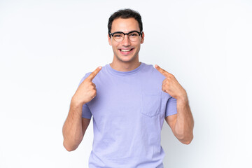 Young caucasian man isolated on white background giving a thumbs up gesture