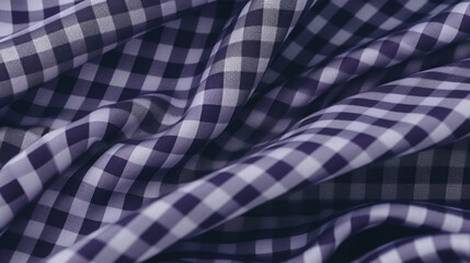 A wavy texture of a purple and white checkered cloth, providing a dynamic and vibrant textile background.