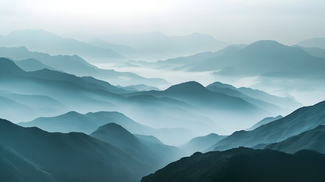tranquil morning with layers of mountains veiled in mist, showcasing the serene beauty of untouched nature.