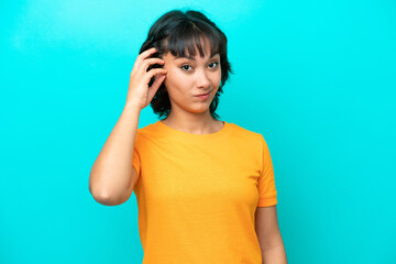Young Argentinian woman isolated on blue background with an expression of frustration and not...