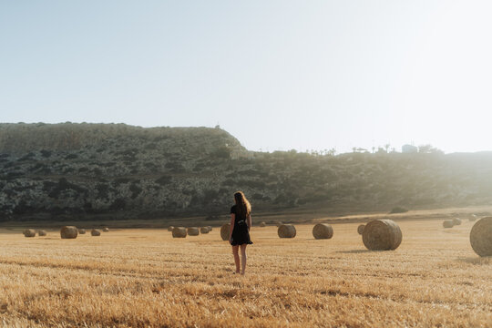 Woman walking in the fields of Cape Greco Peninsula