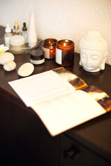 Candles and skincare products on table
