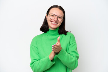 Young caucasian woman isolated on white background applauding after presentation in a conference