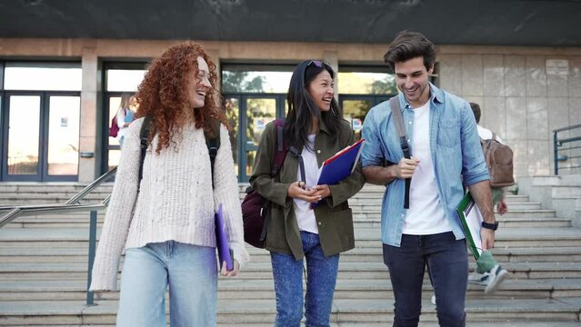 University students walking outside the Economics and Business Administration Faculty building