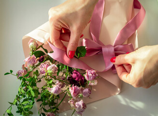 Concept shot of the background theme, wrapping paper, dried roses other flowers and other arrangements. Wedding