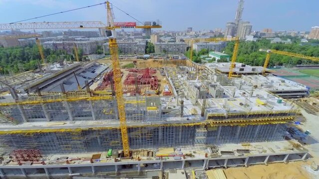 Construction site of soccer stadium CSKA against cityscape