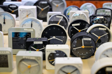 Clock shop. Old alarm clock for sale. Vintage home clocks. Concept of time. 