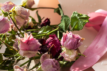 Obraz premium Concept shot of the background theme, wrapping paper, dried roses other flowers and other arrangements. Valentines day