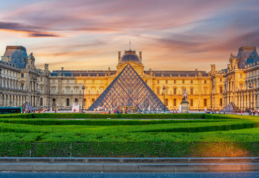 Louvre museum and pyramid at sunset, Paris, France