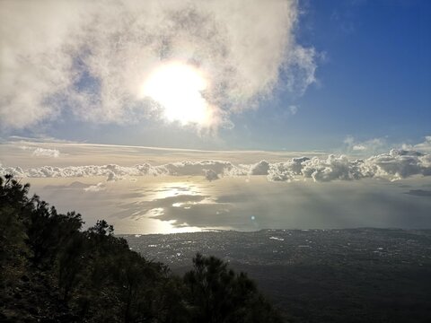 Clouds in the blue sky over the sea near Pompeii, view from the top of the vulcano