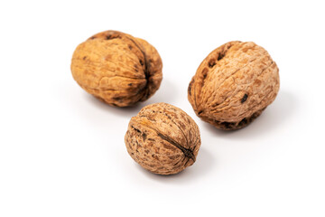 Delicious whole walnuts, isolated on white background