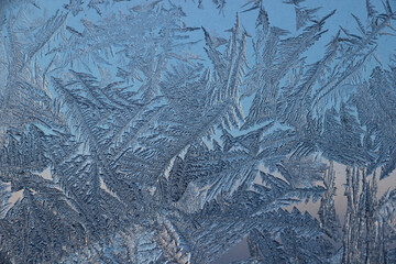 Winter frosty patterns on window glass