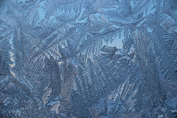 Winter frosty patterns on window glass