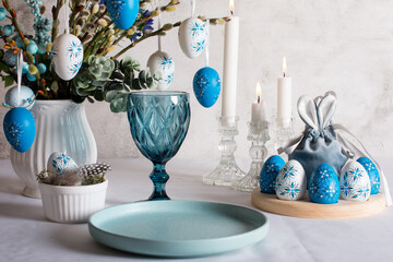 Easter table setting, painted eggs. Easter willow in a vase greeting card