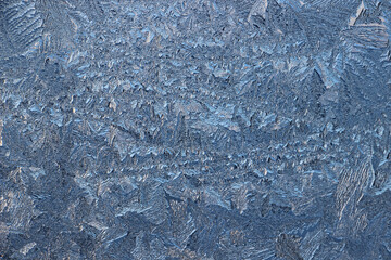 Winter frosty patterns on window glass