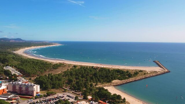 Aerial wide shot of beautiful Cabedelo beach in Viana do Castelo, Portugal. Cabedelo is famous for its waves and wind which makes it a popular destination for those looking for a perfect place to surf