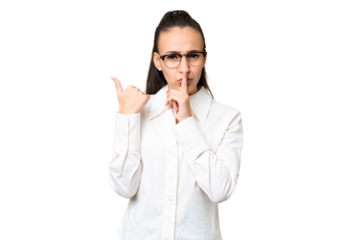 Young Arabian woman over isolated chroma key background pointing to the side and doing silence gesture