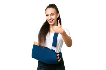 Young Arabian woman with broken arm and wearing a sling over isolated chroma key background with...