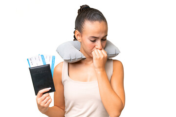 Young Arab woman with Inflatable Travel Pillow over isolated background having doubts