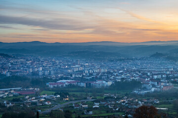 Panorama view of the skyline of the Galician city of Ourense at dusk as seen from the outskirts. - 709056674