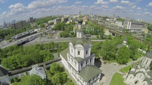 Cityscape with Spaso-Andronikov monastery and traffic on quay