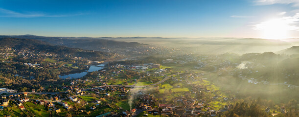 Panorama view of the skyline of the Galician city of Ourense at dusk as seen from the outskirts. - 709057070