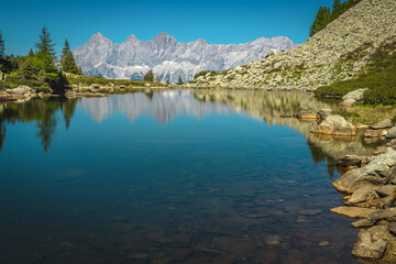 Picturesque mountain lake and high mountain ridges in Austria