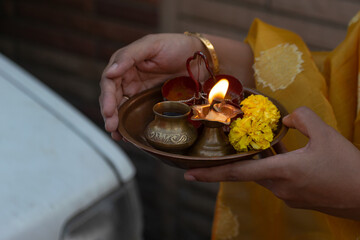 Indian Hindu Pooja thali during a festival or marriage. Kumkum, haldi, pan, paan, kalash, chawal,...