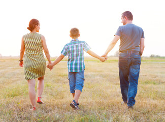 Young family with little son outdoors