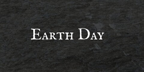 Earth day banner with stylish writing on black dark.