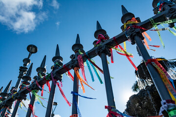 Ribbons of Bonfim souvenirs tied to the railing of the fountain at Largo Terreiro de Jesus in...