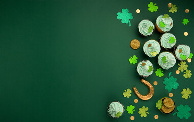 St. Patrick's Day vanilla and chocolate cupcakes with green frosting and  shiny clover decorations...